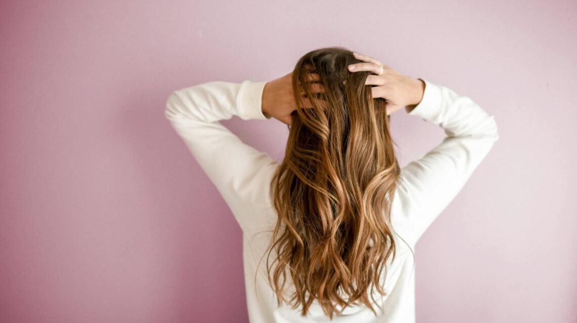 woman wearing white long sleeved shirt