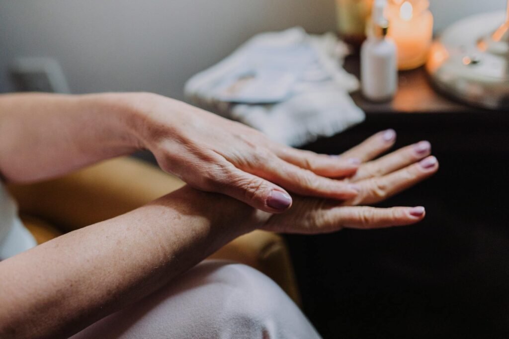 person s hands with manicured nails