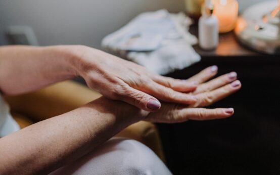 person s hands with manicured nails